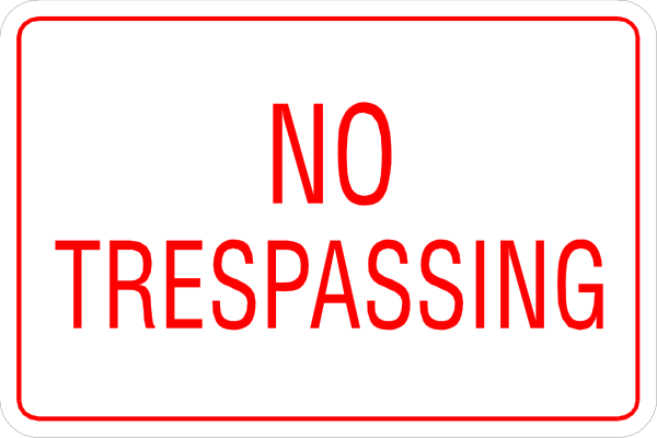 The picture shows a sign that says "No trespassing" with an arrow pointing to its right side indicating restricted area.