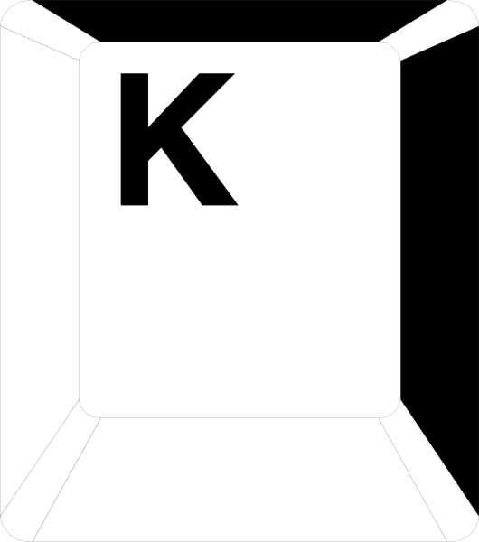 The image shows a white sign with black lettering that reads "K".