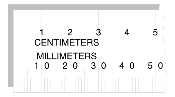 The image shows a ruler with measurements on it placed against an object that has "centimeters" written across its length at one end.