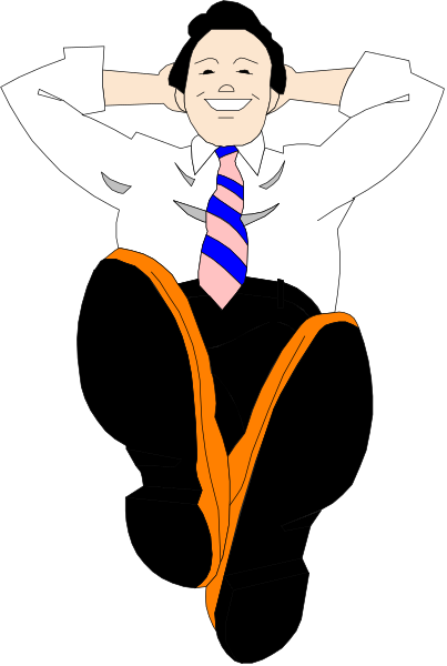 The image shows a man sitting with his feet up on an orange object that resembles a chair; he is wearing a suit jacket over a blue shirt paired with red tie, has dark hair, glasses, and appears to be smiling at something off-frame while looking relaxed in the pose.