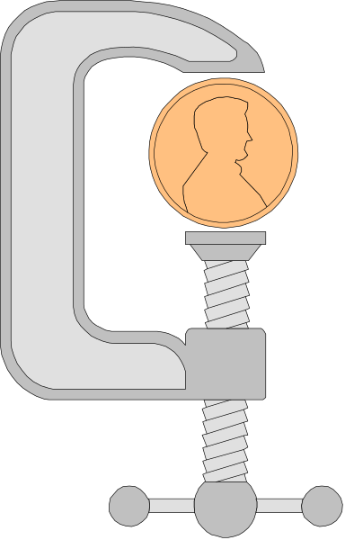 The image shows a coin slot with an orange penny inserted into it on top of what appears to be a mechanical device that has gears around its base.