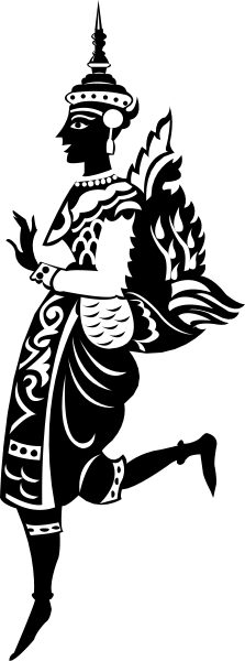 The black and white photo shows a person with an intricate headdress standing against a dark background; it's cropped to show only from mid-thigh upwards.