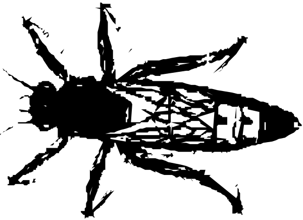 The image shows a black and white photo of an object that appears to be made up of various shapes like circles and rectangles with some sort of pattern on it.