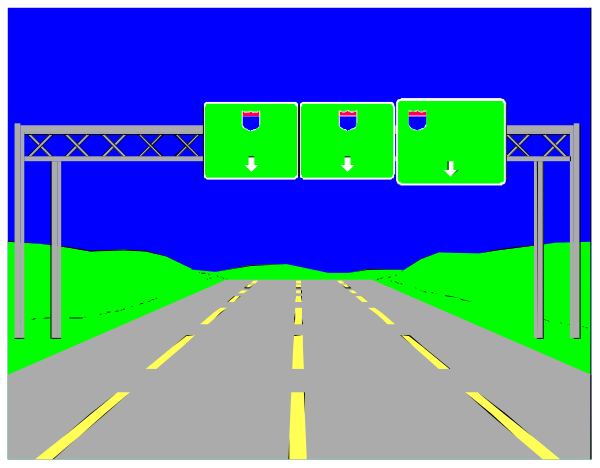 The image shows a highway sign with multiple lanes of traffic on either side at nighttime under an overcast sky.