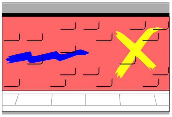 The image shows a brick wall with two signs on it: "X" is blue and has an exclamation mark next to it; there's also another sign that appears damaged but still visible in red, which seems like part of a larger message obscured by bricks or tiles placed over the letters.