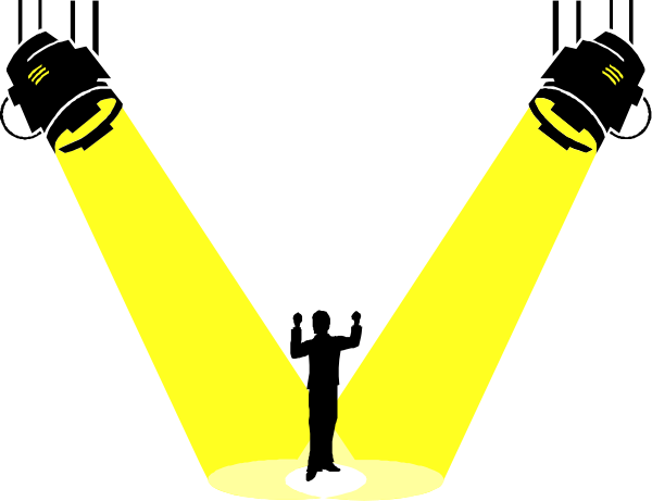 The image shows a black background with three yellow spotlights shining downwards from above; there is also an upside-down person standing on one leg in front of two of these lights.