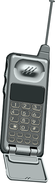 The image shows a closeup of an old flip phone with its screen open to display buttons on it against a blurred background that appears dark grey in color.
