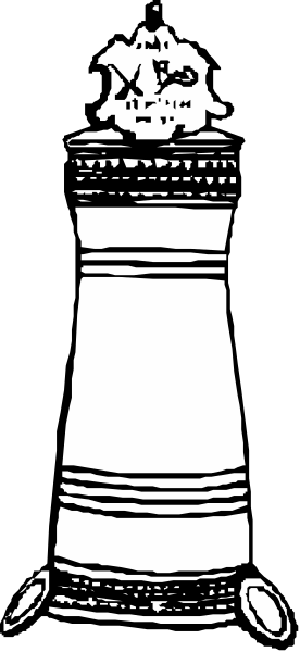 The black and white photo shows a chess piece with an intricate design on it placed against a plain background.