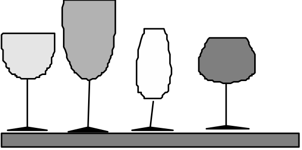 The image shows a black train with white dots on it traveling through an unspecified landscape at nighttime.