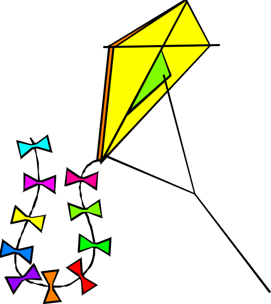 The image shows a kite with streamers flying against a dark background at nighttime.