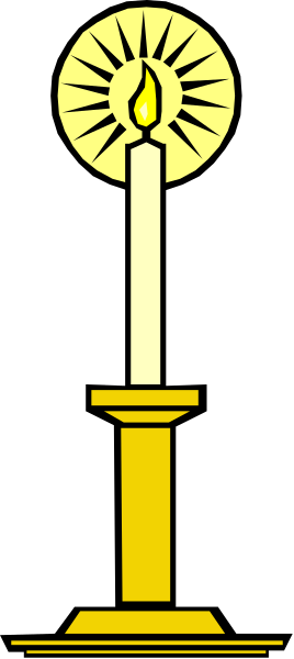 The image shows a candle with an illuminated wick inside of it on top of what appears to be a pedestal-like structure against a dark background.