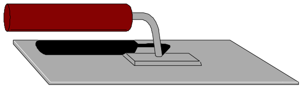 The image shows a red stapler on top of an object that resembles a white keyboard with black keys.