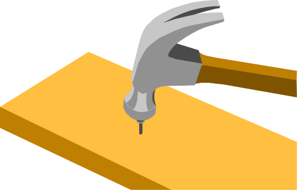 The image shows a wrench with its head on top of an object that appears to be made from Lego bricks in shades of yellow and orange.