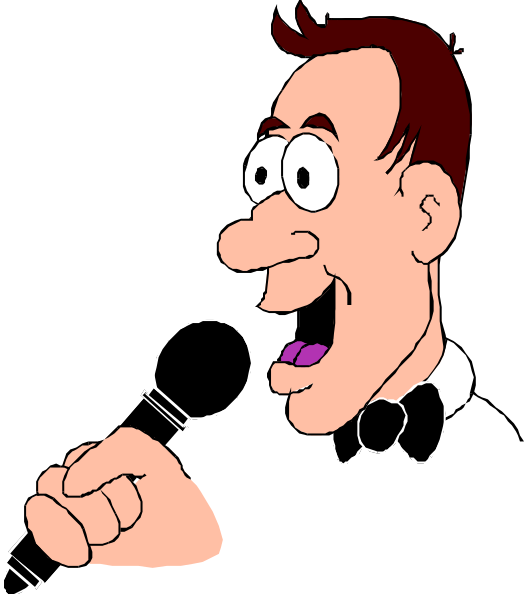 The cartoon shows a man with glasses holding a microphone while speaking into it; he is wearing a black tie and has dark hair.