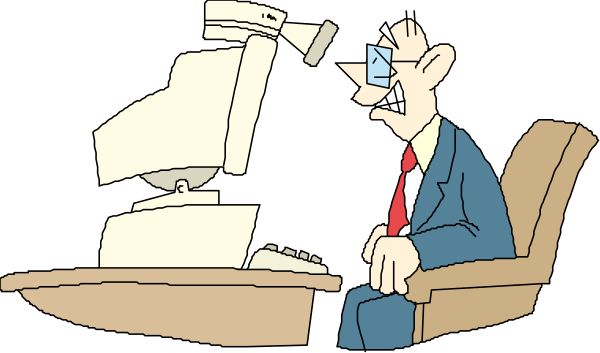 The cartoon shows a man sitting at his desk with an angry expression on his face while looking up from his computer screen to see another person standing in front of him holding two papers; he is wearing glasses and has short hair, dressed casually in blue jeans and no shirt visible under the sweater.