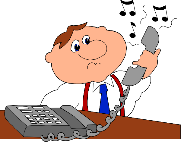The cartoon shows a man sitting at an office desk with his hand on a telephone receiver while holding papers; he is wearing glasses and has short hair.