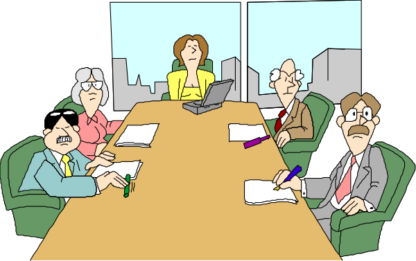 The cartoon shows a group of five animated characters sitting around an oval table with papers on it; there's also one character standing at the end of the table facing them all while holding what appears to be a laptop, and another person is seated in front of her looking towards someone outside the frame.