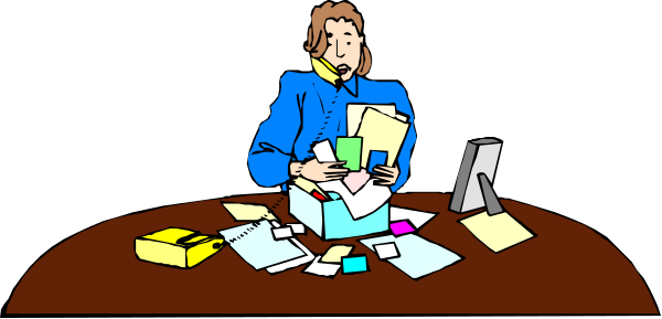 The image shows a person sitting at an office desk with papers scattered around them; there is also another figure standing behind the seated individual who appears to be looking down on some documents in their hands.