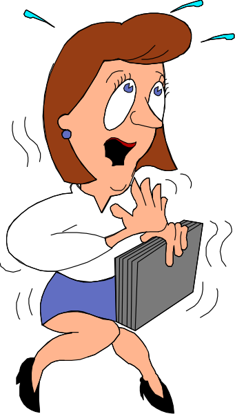 The cartoon shows a woman with blonde hair wearing glasses standing next to an open laptop computer on her desk; she is holding up one hand as if gesturing while speaking.