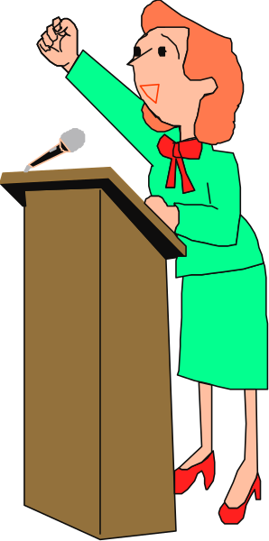 The cartoon depicts a woman standing at a podium with her hand raised as if she is speaking to an audience in front of microphones on stands behind her; there's no visible text within this image, and it appears that only one person (the female figure) is present in the scene.