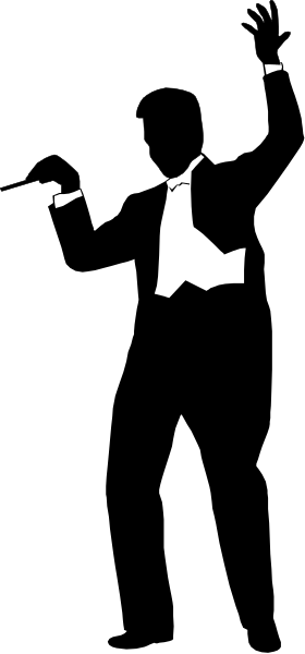 The image shows a black and white photo of an object with multiple parts that resemble puzzle pieces connected together to form a larger shape; it is set against a dark background which contrasts sharply with its lighter color, emphasizing its presence in the frame.