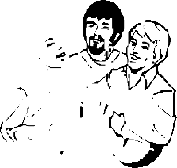 The black and white photo shows two individuals standing close to each other with a man on left looking at camera while another person is slightly out of focus in background; both appear relaxed yet engaged.