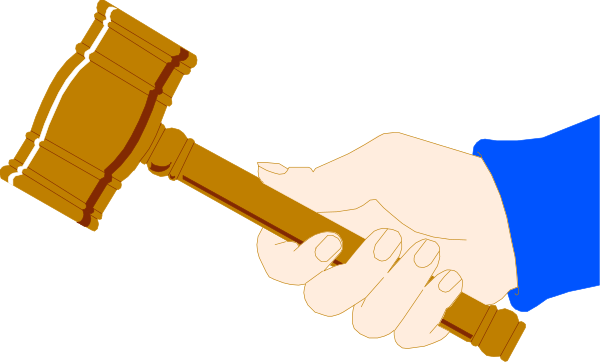 The image shows a hand holding an object that resembles a gavel with two hands clasped together around it against a blue background.