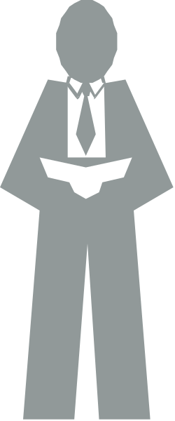 The image shows a black and white silhouette of an adult male figure standing against a dark background with his back to us; he is wearing business attire including pants, shirt, tie, jacket, shoes, belt, and has short hair.