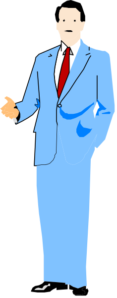 The image shows a man standing against a gray background with his hands on hips; he is wearing a suit jacket over an unseen shirt and tie combination.