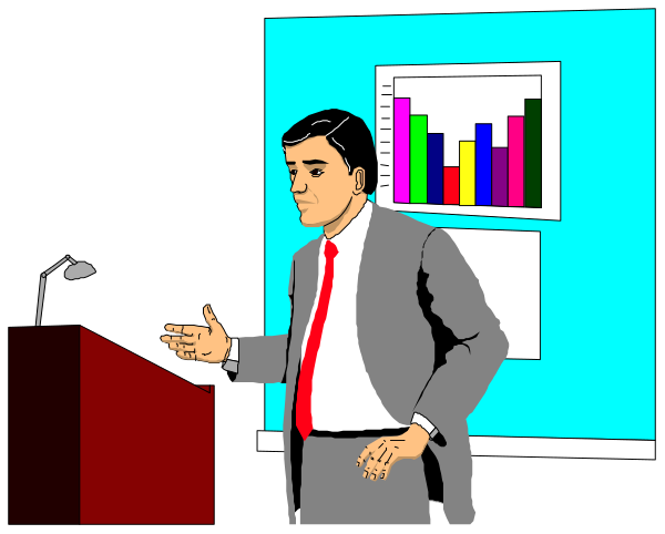 The image shows a man standing at a podium with his hands clasped together while gesturing towards an audience that is out of frame; he appears to be giving a presentation in front of a screen displaying colorful bar graphs and charts, which suggests some form of data analysis or reporting being discussed.