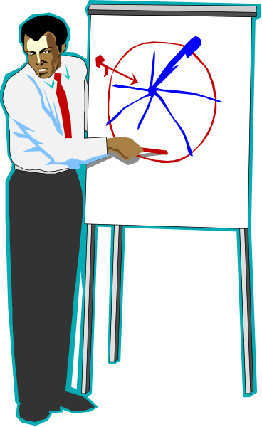 The image shows a man standing next to an easel with a presentation board that has diagrams on it; he is pointing at one of these diagrams while holding what appears to be a marker in his hand, suggesting he might be giving a lecture or explaining something related to the content displayed on the board.