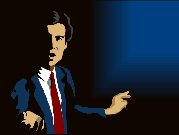 The image shows a cartoon of an animated man with dark hair wearing glasses standing on stage holding up his finger as if to emphasize something he is saying while gesturing towards someone in front of him who appears surprised, set against a blue background that suggests darkness or nighttime.