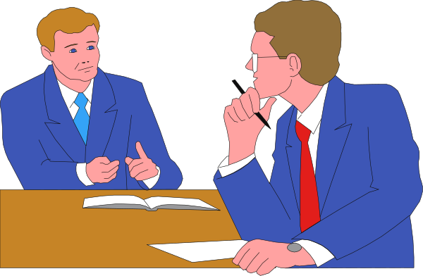 The image shows a cartoon of two men sitting at a table with papers on it; both have their hands to their chins in thoughtful poses while looking towards each other across an open book between them, suggesting discussion or debate about its contents.