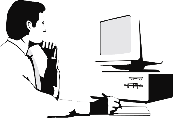 The black and white image shows a person sitting at an office desk with their hands on their face, looking downward towards what appears to be a computer monitor in front of them.