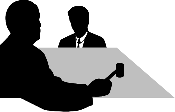 The image shows a black and white silhouette of an office environment with various pieces of furniture such as desks and chairs visible in different orientations against a dark background.