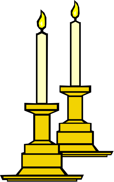 The image shows two lit candles on a table with three wicks each against a dark background.