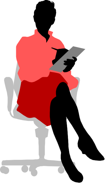 The image shows a person sitting at an office desk with their back to us; we see only from behind as if looking over them. They appear focused on something in front of them that is out of view.