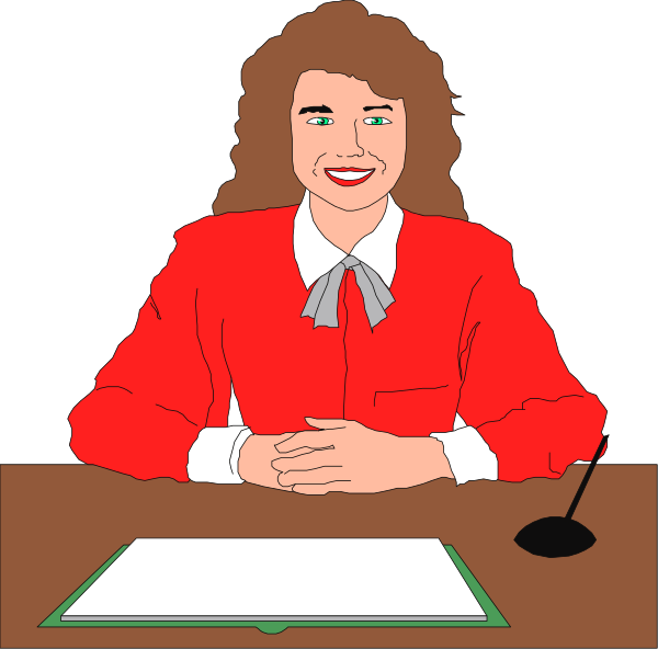 The image shows a cartoon of an adult female character sitting at a desk with her hands clasped together on top of it in front of her chest. She is wearing glasses and has short brown hair styled into bangs, along with shoulder-length waves that fall over one ear. Her attire consists of a red blazer or jacket worn over what appears to be an orange shirt, paired with white pants; she also wears a dark tie around her neck. The character is smiling and looking directly at the viewer while seated in front of a microphone on top of a desk