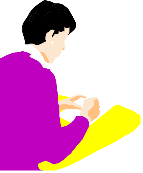 The image shows a person sitting at a desk with an open book on it, holding what appears to be a pen over the page of the book as if writing in it.