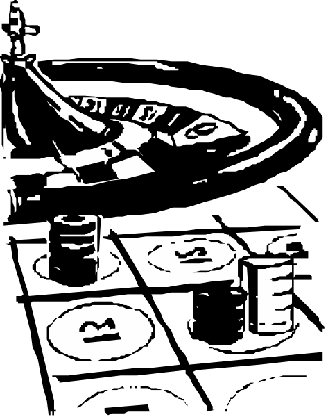 The black and white photo shows a table with various items on it including what appears to be playing cards spread out across its surface in front of an open book that is lying flat.
