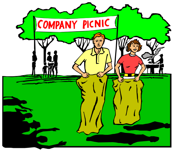 The image shows a man standing next to an advertisement for "Company Picnic" with two figures wrapped from head-to-foot in what appears to be plastic wrap; it's set outdoors during daylight, and there is no text present that provides additional context or information about the scene.