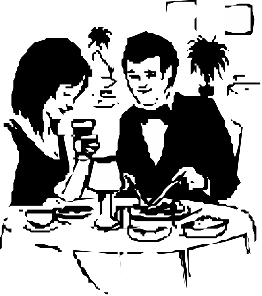 The black and white photo shows a person sitting at an indoor table with their back to us; there's another figure in front of them who appears to be writing on paper placed before both individuals.