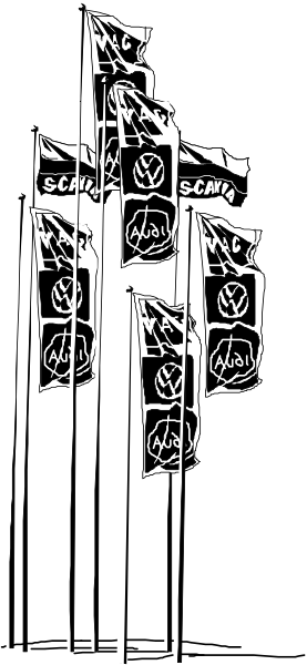 The image shows a black and white photo of an object with various symbols on it that resemble flags from different countries displayed in front of what appears to be a building facade at nighttime.