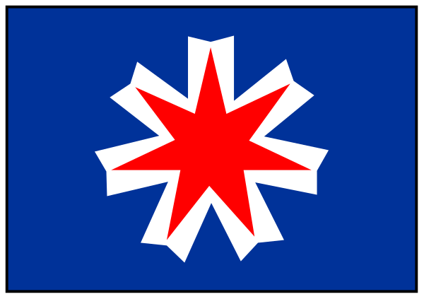 The image shows a pixelated depiction of an electric battery with a blue background on its left side featuring what appears to be a stylized flag design resembling that of New Zealand's national emblem, and red starburst shapes around it.
