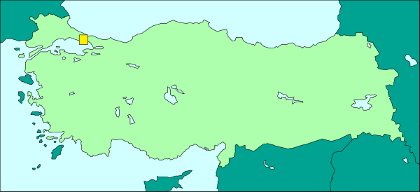 The map shows a country with various regions labeled on it; there's an island to the left of another larger landmass in green tones, indicating vegetation-rich areas.