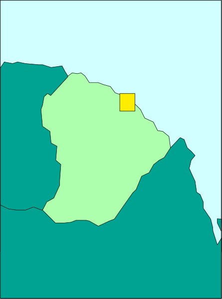 The map shows a stylized representation of an island with two distinct areas: green for landmasses and blue for water bodies; there is also one yellow square on top left corner which could represent something specific, but it's not clear what that represents from this image alone.