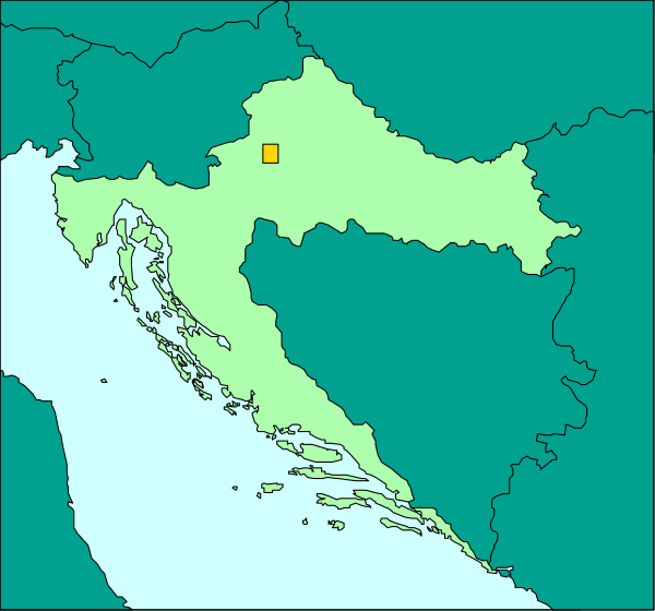 The map shows a country with its capital highlighted by an orange square on top of it; there is no text present within this image to provide additional context about what might be depicted in such areas as cities, towns, and regions.