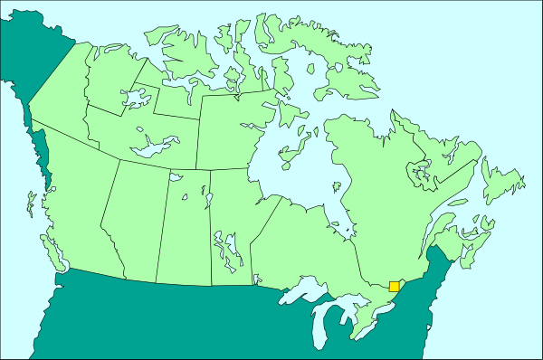The map shows a section of Canada with provinces labeled; it's overlaid on an outline that resembles North America but is stylized to look like a face wearing glasses.