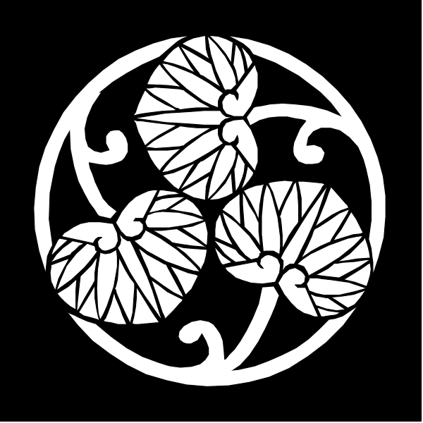 The black and white logo features a stylized design of three leaves with intricate patterns around them on top of an oval background.