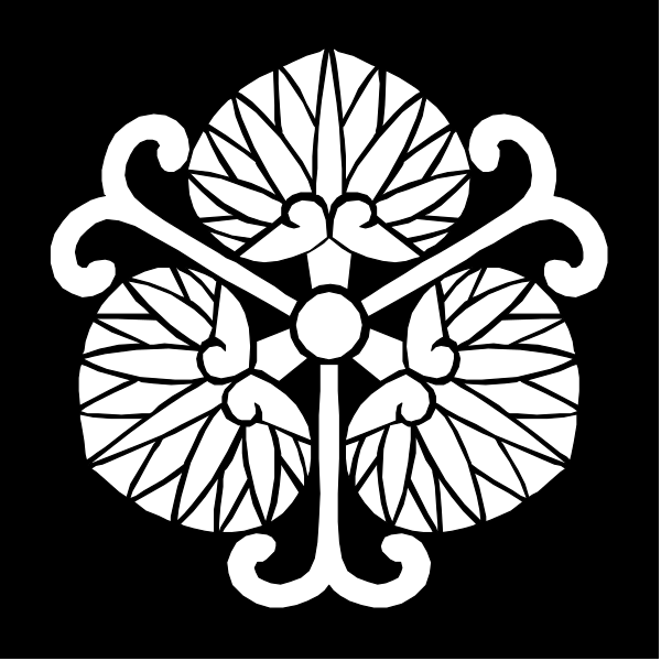 The black and white logo features a stylized flower with six petals arranged around an intricate centerpiece that resembles leaves on either side of two vertical lines connected by horizontal ones at their ends.